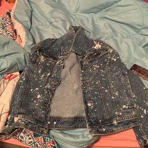 a Looney Tunes Members Only jean jacket, still has the tags on it. Med size